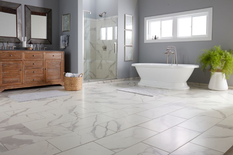 snowy marble-look tile by bel terra, white marble-look tile in bathroom